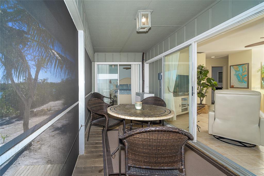 290 South Gulf Boulevard, Unit 31 Placida, FL 33946 - Photo 20 of 63 a view of a dining room with furniture window and wooden floor