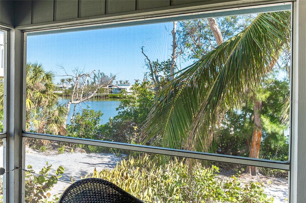 290 South Gulf Boulevard, Unit 31 Placida, FL 33946 - Photo 21 of 63 a view of a balcony with plants and a bench