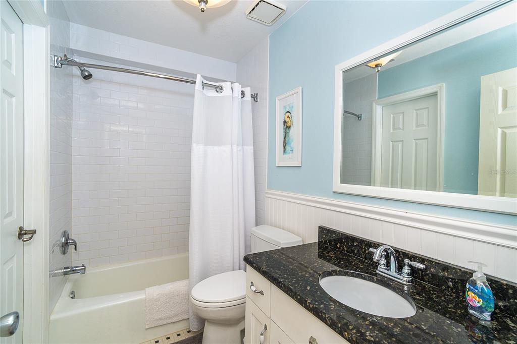 290 South Gulf Boulevard, Unit 31 Placida, FL 33946 - Photo 26 of 63 a bathroom with a shower sink vanity mirror and toilet