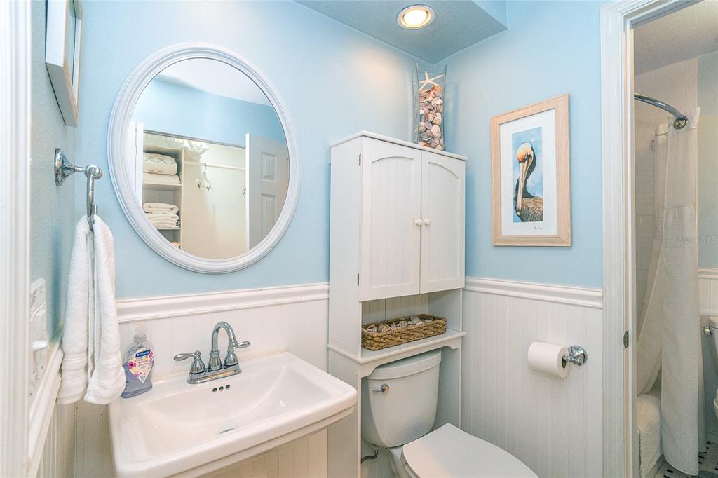 290 South Gulf Boulevard, Unit 31 Placida, FL 33946 - Photo 28 of 63 a bathroom with a sink mirror and toilet