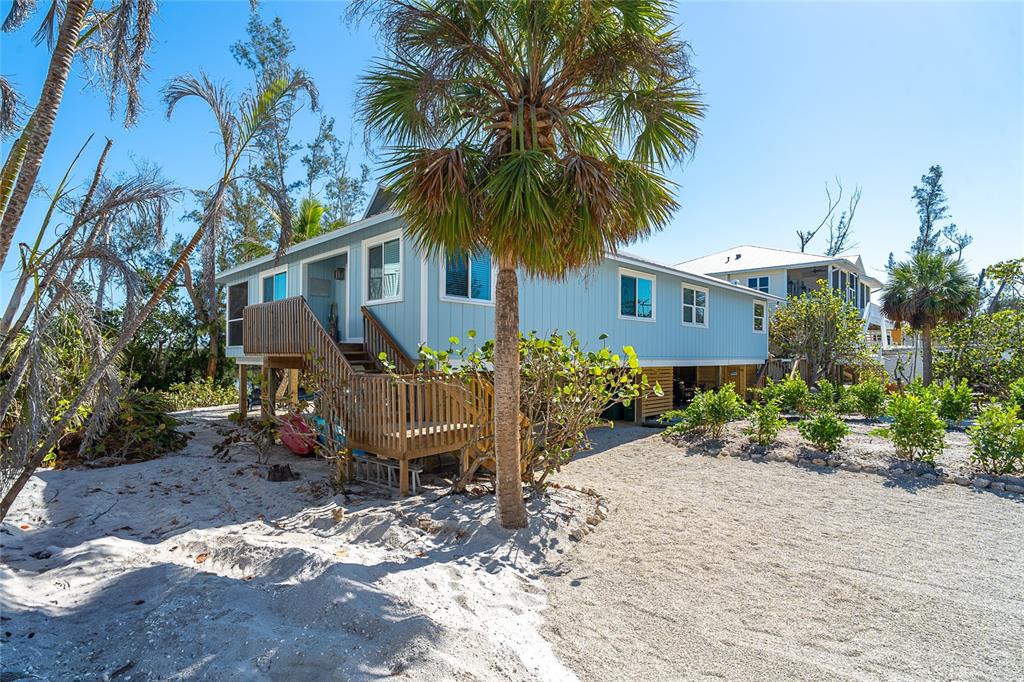 290 South Gulf Boulevard, Unit 31 Placida, FL 33946 - Photo 3 of 63 a view of a backyard with plants and a patio