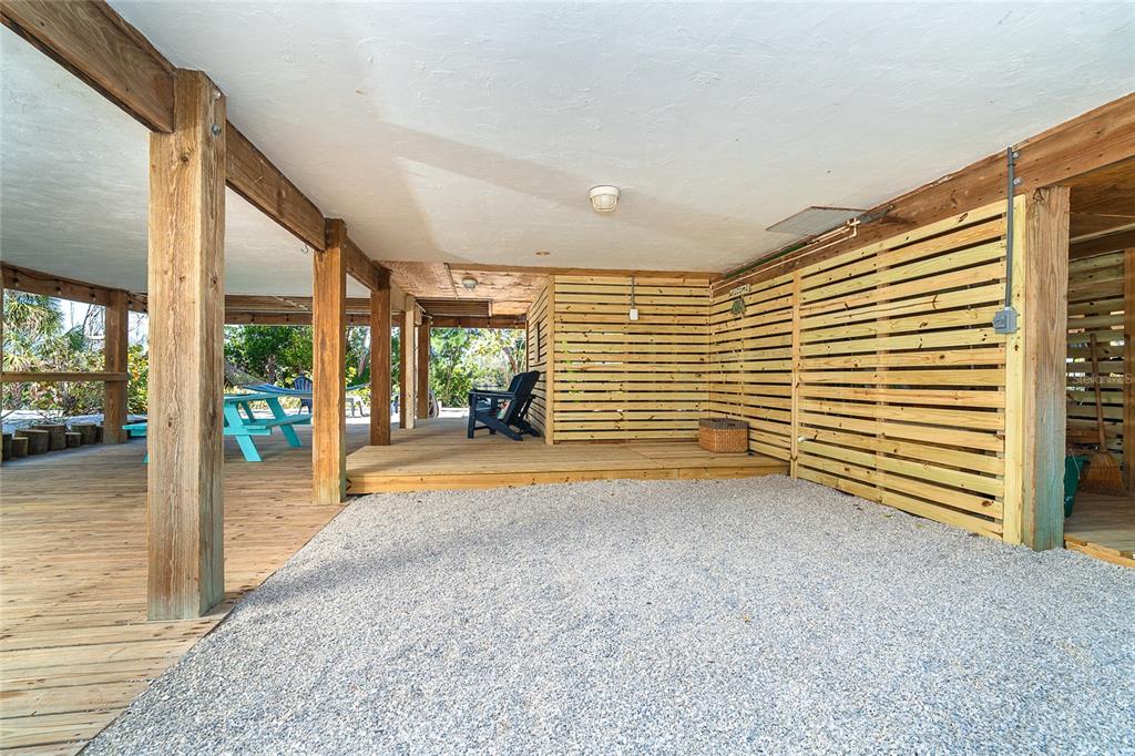 290 South Gulf Boulevard, Unit 31 Placida, FL 33946 - Photo 32 of 63 a view of empty room with wooden floor and floor to ceiling window