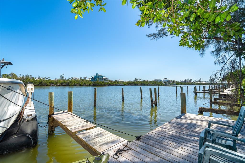 290 South Gulf Boulevard, Unit 31 Placida, FL 33946 - Photo 42 of 63 a view of a balcony with wooden floor and lake view