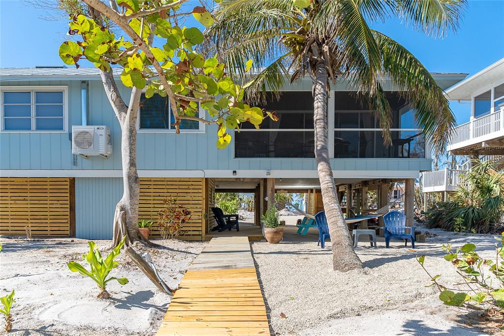 290 South Gulf Boulevard, Unit 31 Placida, FL 33946 - Photo 44 of 63 a view of a chairs and a table in the patio