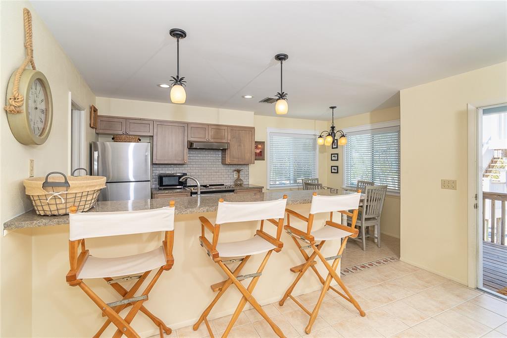 290 South Gulf Boulevard, Unit 31 Placida, FL 33946 - Photo 9 of 63 a large kitchen with a table and chairs