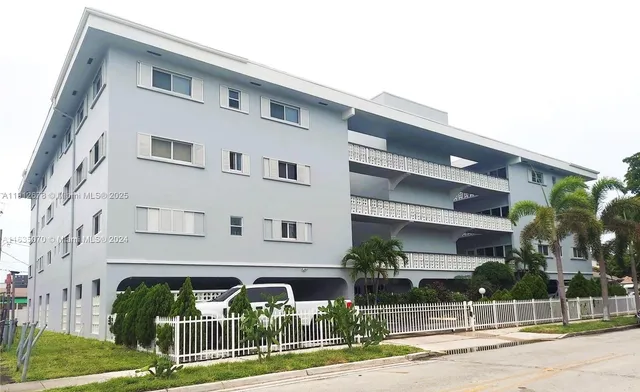 a front view of building with yard