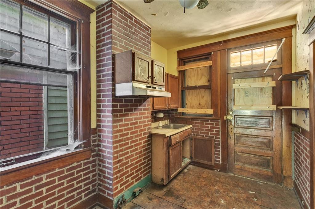 2040 Laketon Road Pittsburgh, PA 15221 - Photo 13 of 26 a bathroom with a sink a mirror and shower