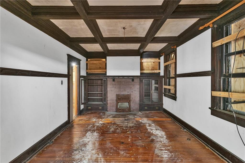2040 Laketon Road Pittsburgh, PA 15221 - Photo 16 of 26 a view of a hallway with wooden floor and staircase