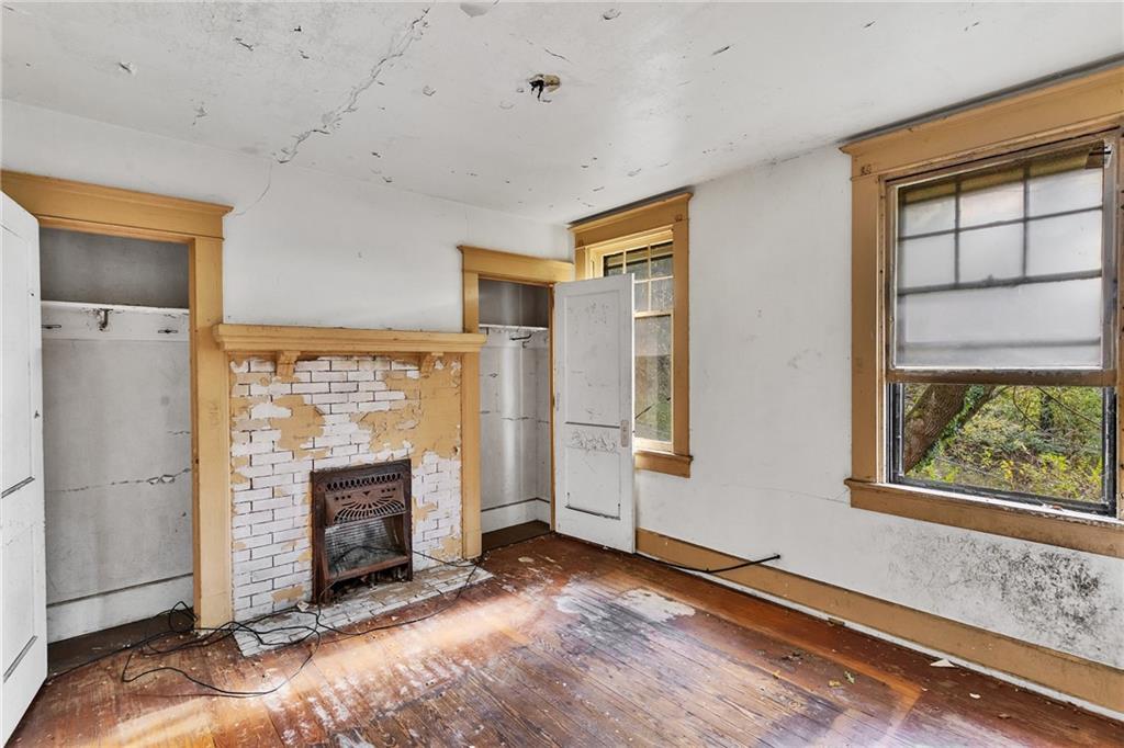 2040 Laketon Road Pittsburgh, PA 15221 - Photo 21 of 26 a view of a livingroom with a fireplace and window