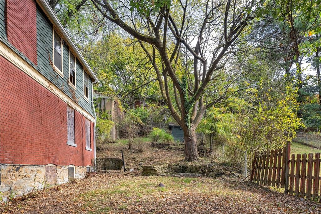 2040 Laketon Road Pittsburgh, PA 15221 - Photo 3 of 26 a view of a patio with iron fence