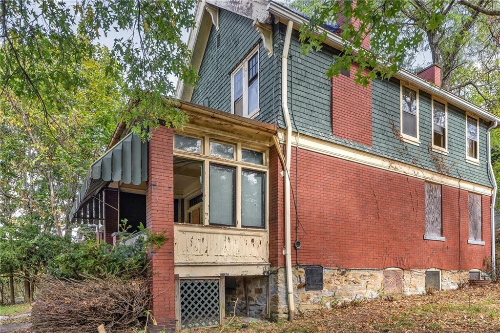 2040 Laketon Road Pittsburgh, PA 15221 - Photo 4 of 26 a front view of a house with a tree