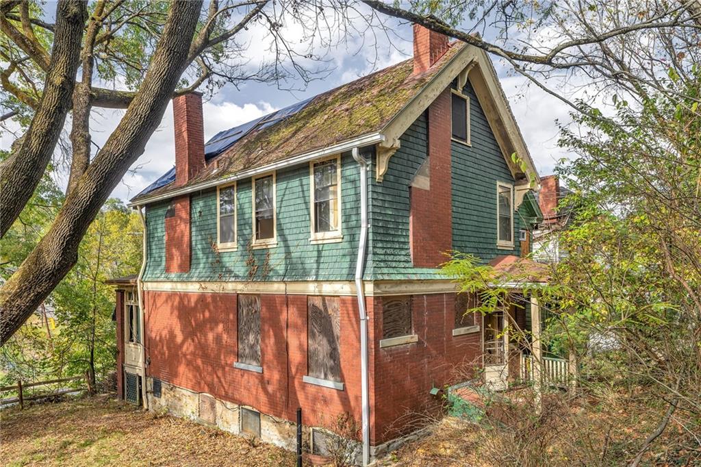2040 Laketon Road Pittsburgh, PA 15221 - Photo 6 of 26 a view of house with a yard and seating space