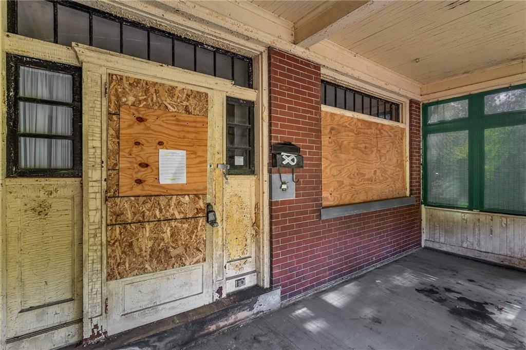 2040 Laketon Road Pittsburgh, PA 15221 - Photo 7 of 26 a view of a brick house with an outdoor space