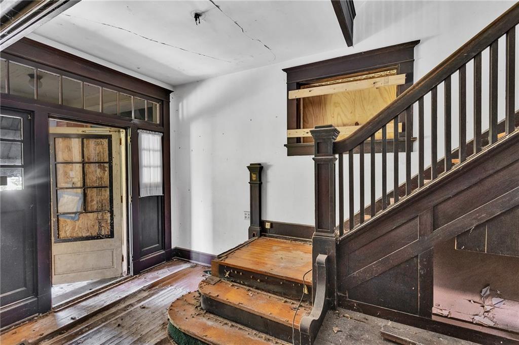 2040 Laketon Road Pittsburgh, PA 15221 - Photo 10 of 26 a living room with wooden floor and a balcony