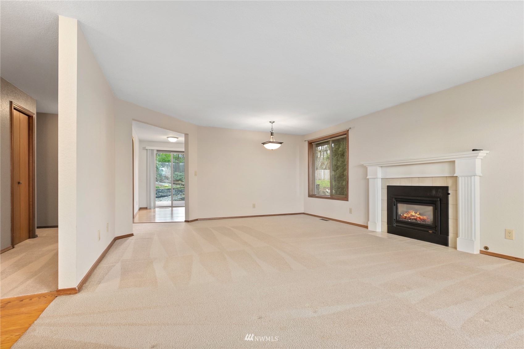 1341 McLeod Road Bellingham, WA 98226 - Photo 10 of 33 a view of an empty room with a window and fireplace