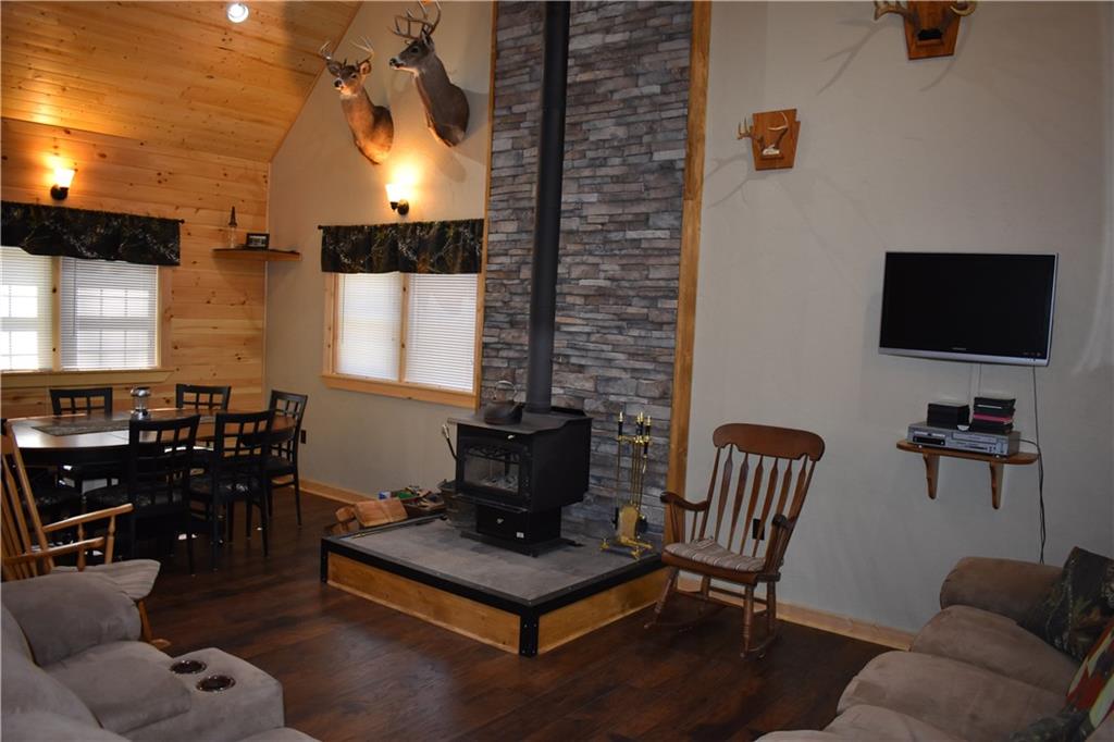 155 Rock Run Road Rector, PA 15677 - Photo 3 of 23 The great room features ample room for entertaining and beautiful stonework behind the wood stove