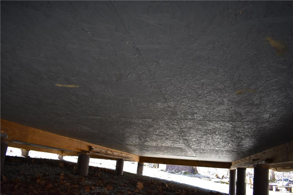 155 Rock Run Road Rector, PA 15677 - Photo 23 of 23 This view under the cabin shows the waterproofing seal to prevent moisture intrusion