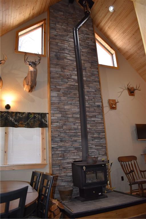 155 Rock Run Road Rector, PA 15677 - Photo 5 of 23 The great room features a 20-foot peaked ceiling, woodburning stove, and awesome stone and woodwork accents