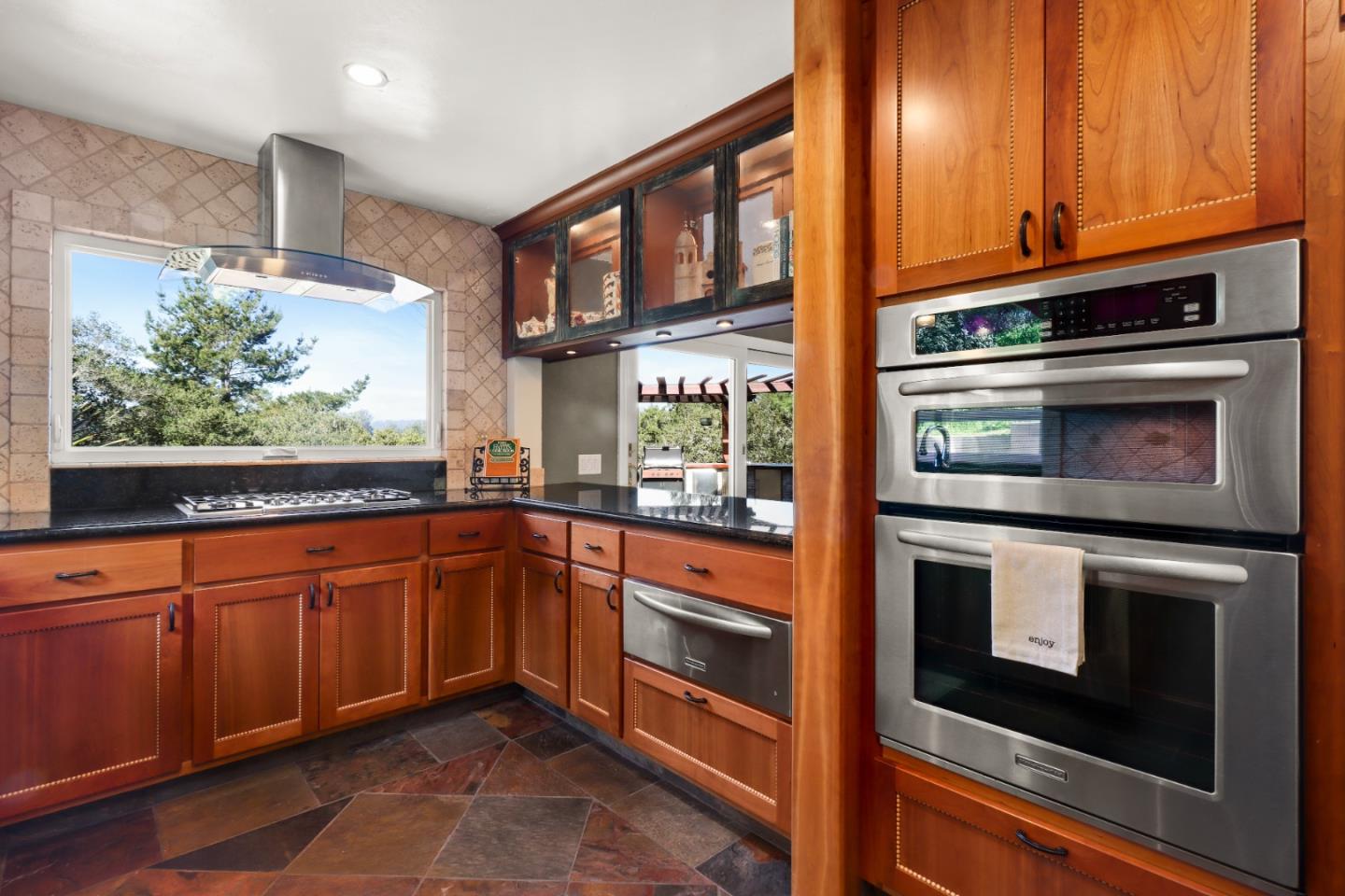 17920 Berta Canyon Road Salinas, CA 93907 - Photo 11 of 36 a kitchen with stainless steel appliances granite countertop a stove and a microwave