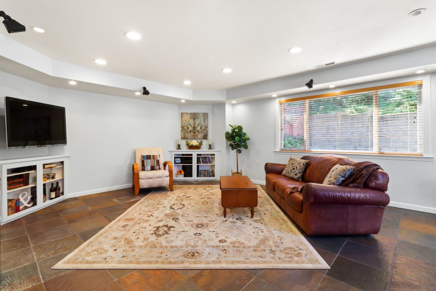 17920 Berta Canyon Road Salinas, CA 93907 - Photo 15 of 36 a living room with furniture and a flat screen tv