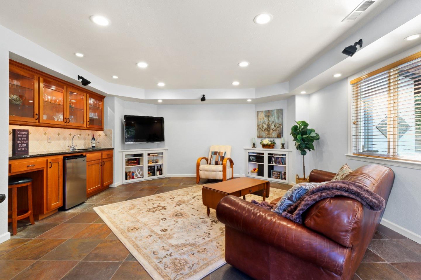 17920 Berta Canyon Road Salinas, CA 93907 - Photo 16 of 36 a living room with fireplace furniture and a flat screen tv
