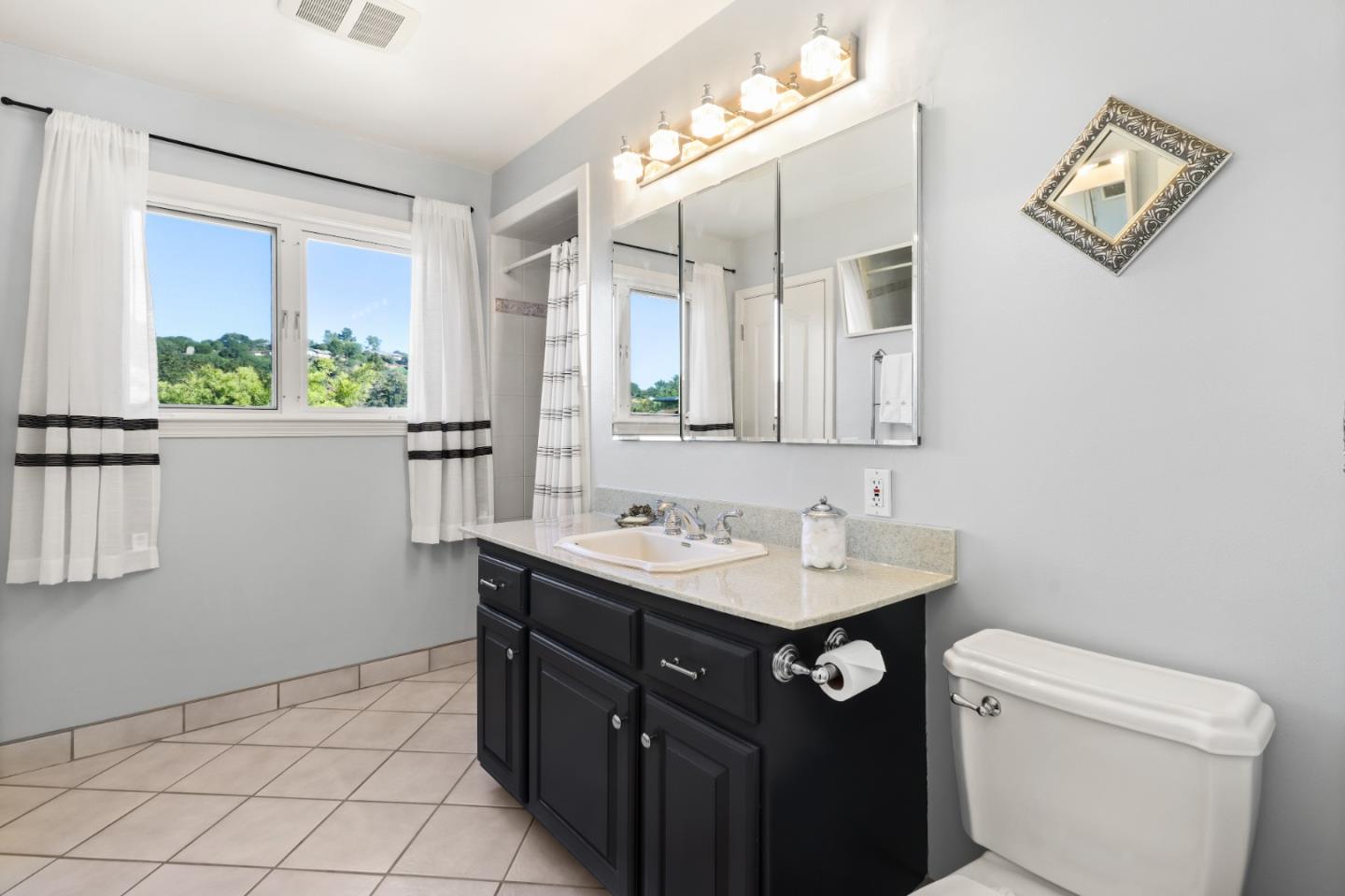 17920 Berta Canyon Road Salinas, CA 93907 - Photo 20 of 36 a bathroom with a toilet sink and mirror