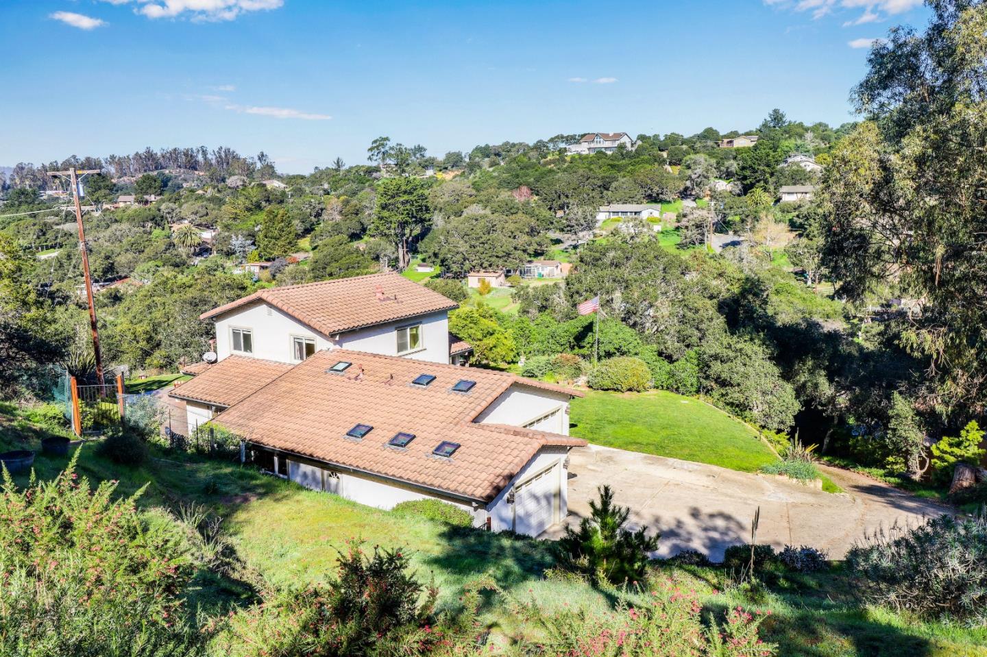 17920 Berta Canyon Road Salinas, CA 93907 - Photo 2 of 36 an aerial view of a house with a yard and lake view