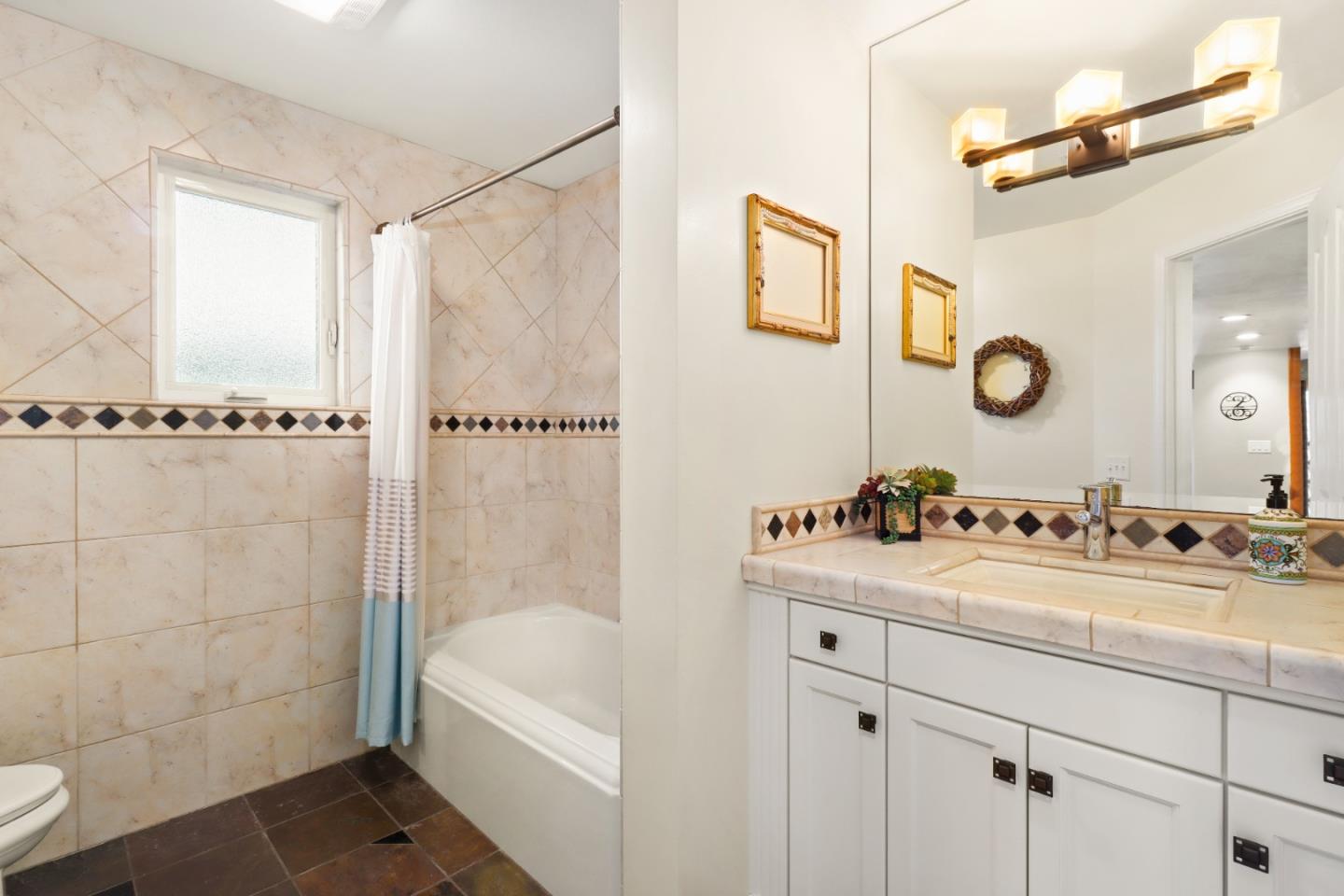 17920 Berta Canyon Road Salinas, CA 93907 - Photo 23 of 36 a bathroom with a tub sink and mirror