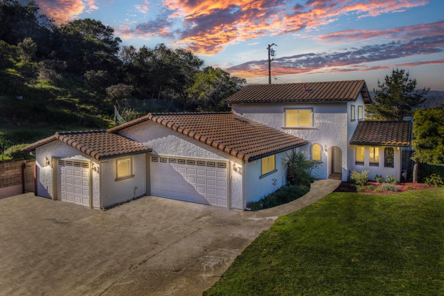 17920 Berta Canyon Road Salinas, CA 93907 - Photo 3 of 36 a front view of a house with a yard and garage