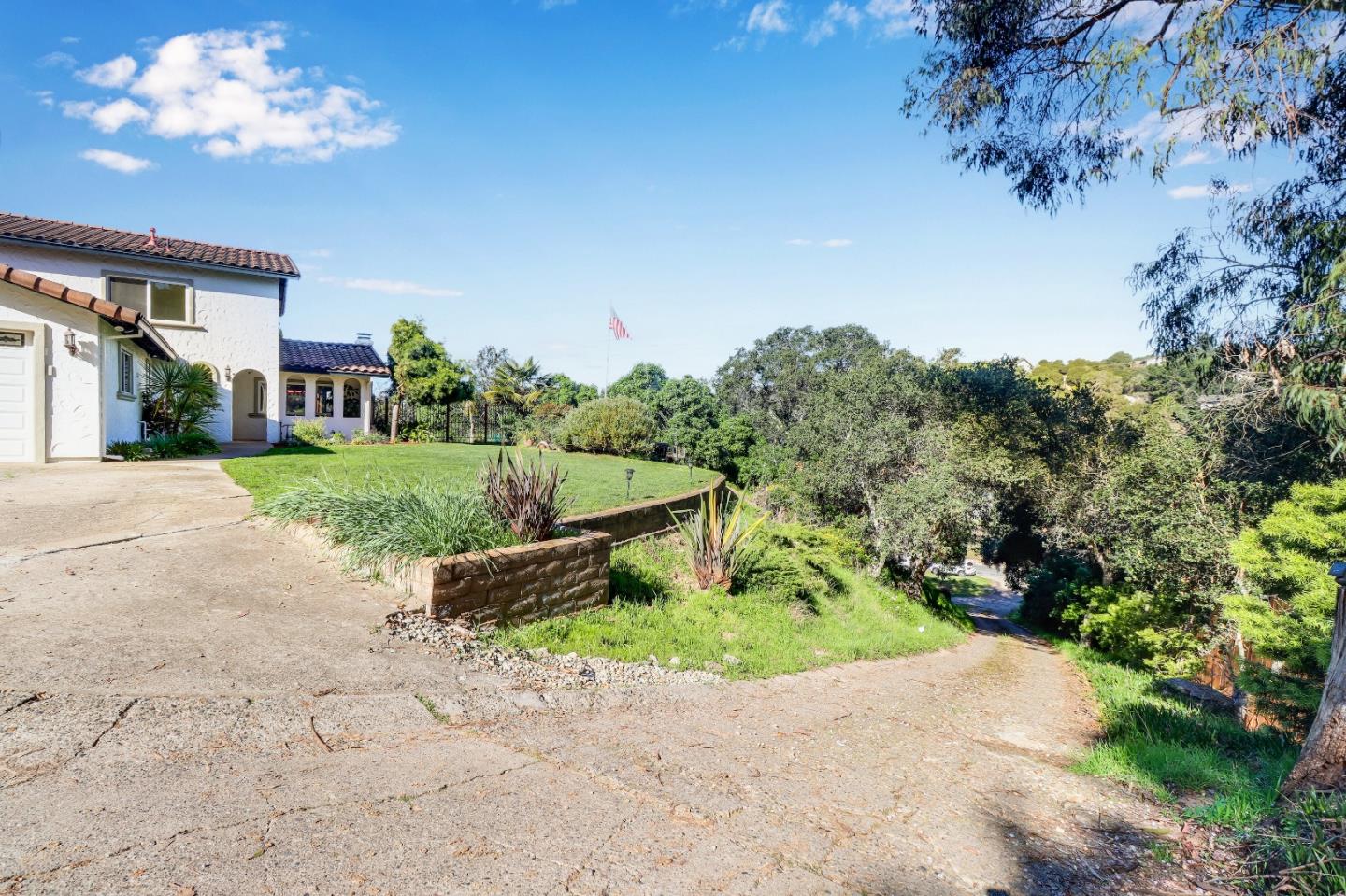 17920 Berta Canyon Road Salinas, CA 93907 - Photo 35 of 36 a view of a house with a yard and a garden