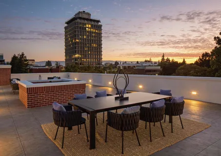 a terrace of a house with outdoor seating