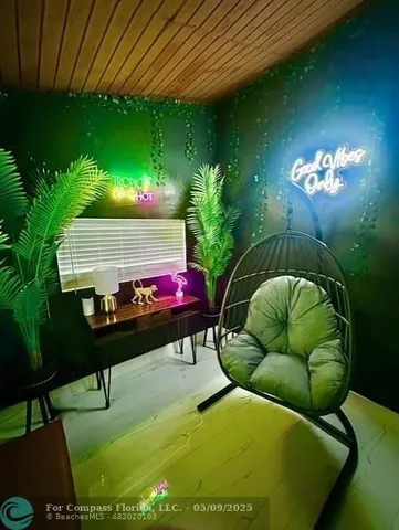 a kitchen with a refrigerator a stove a sink and white cabinets with wooden floor