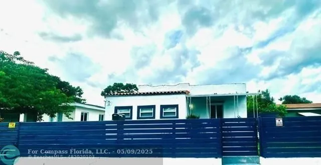 a view of front of house with a yard