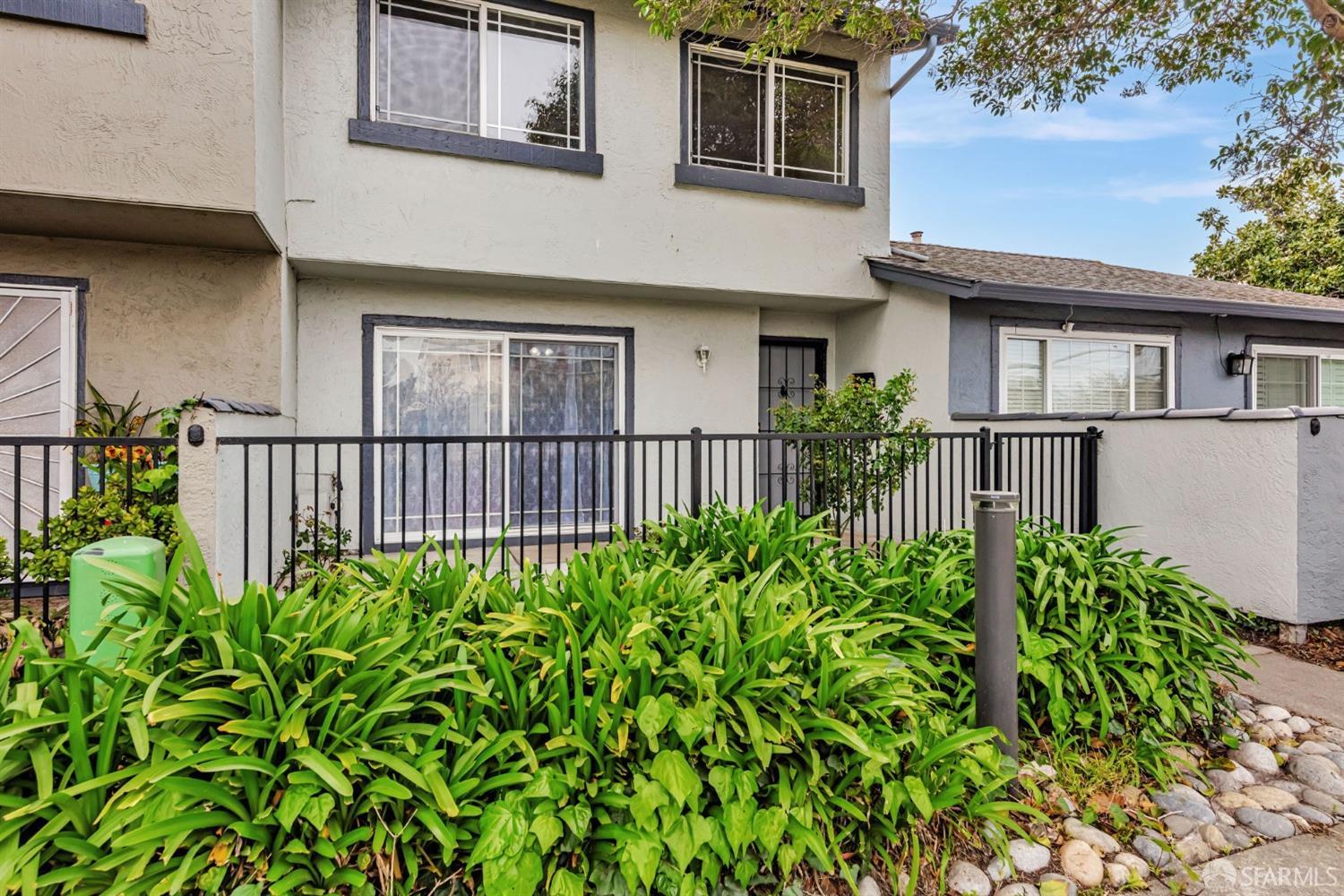 4346 Solano Way Union City, CA 94587 - Photo 1 of 40 a front view of a house with a garden