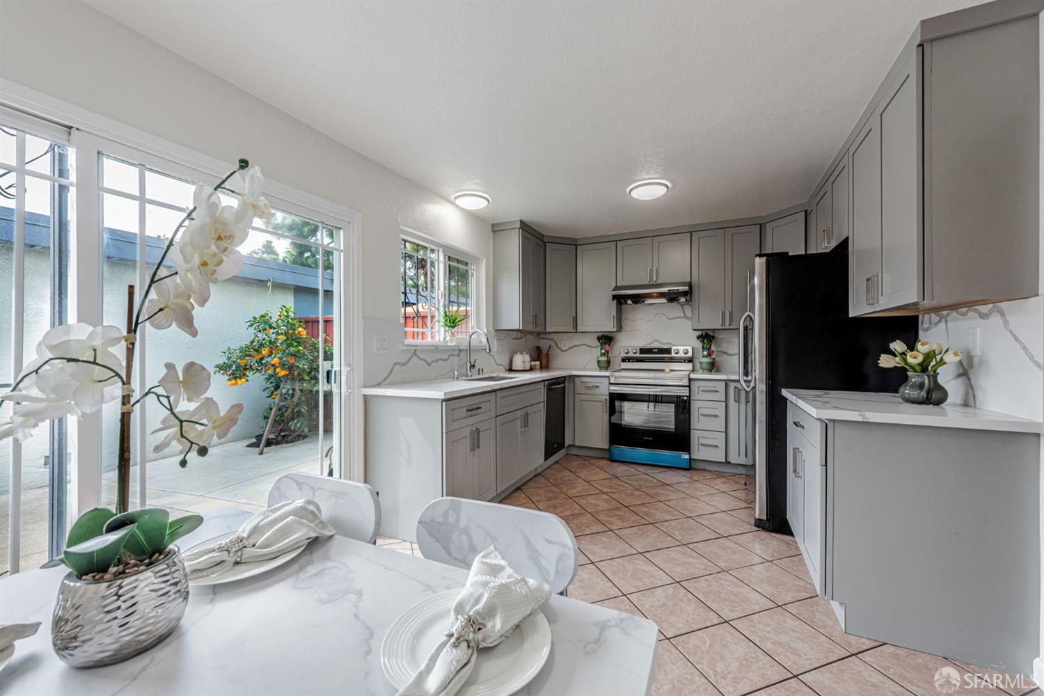 4346 Solano Way Union City, CA 94587 - Photo 13 of 40 a kitchen with granite countertop a sink stainless steel appliances and cabinets