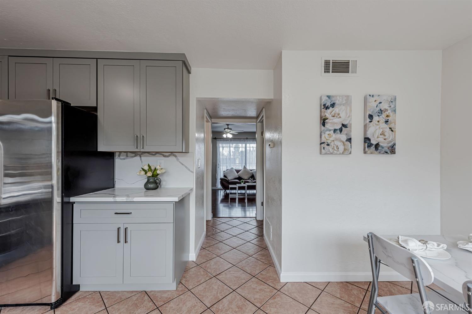 4346 Solano Way Union City, CA 94587 - Photo 14 of 40 a kitchen with a refrigerator and cabinets