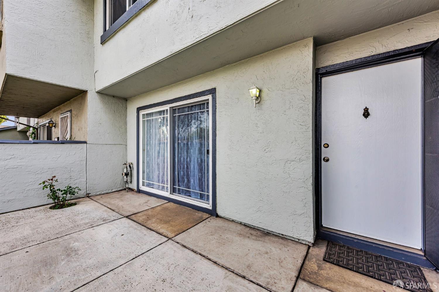 4346 Solano Way Union City, CA 94587 - Photo 2 of 40 a view of a door and chair in a room