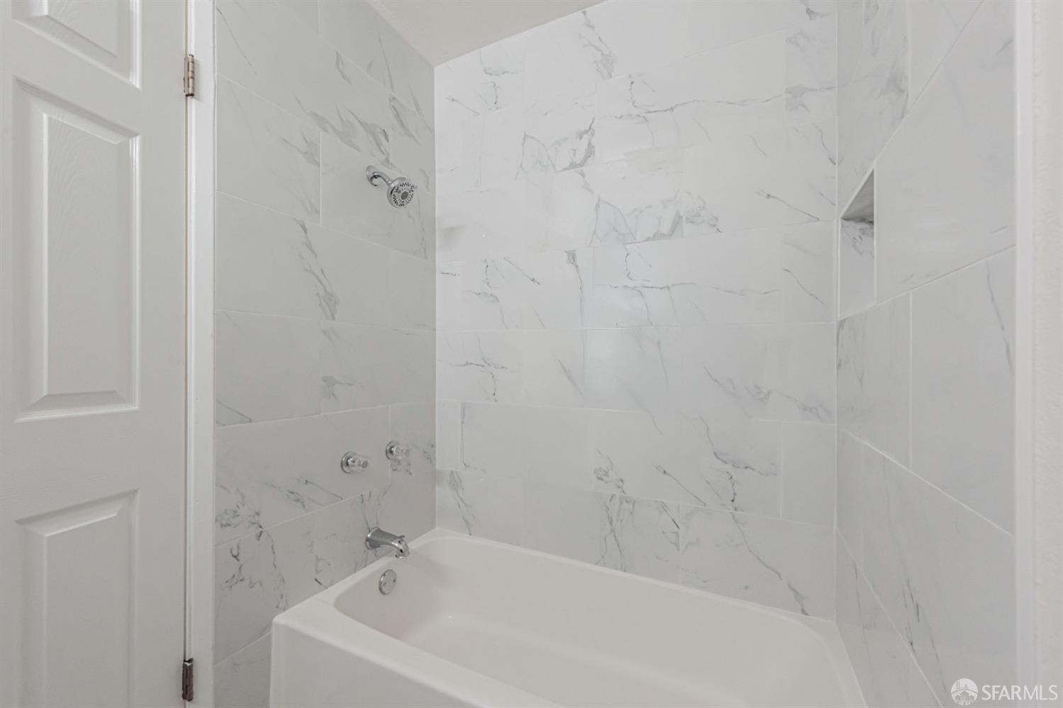 4346 Solano Way Union City, CA 94587 - Photo 26 of 40 a white bath tub sitting next to a white sink and vanity