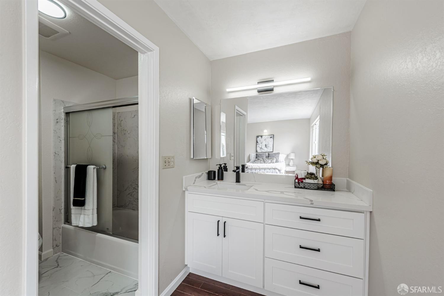 4346 Solano Way Union City, CA 94587 - Photo 27 of 40 a bathroom with a double vanity sink and mirror