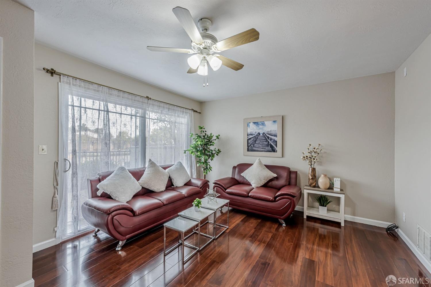 4346 Solano Way Union City, CA 94587 - Photo 3 of 40 a living room with furniture and wooden floor