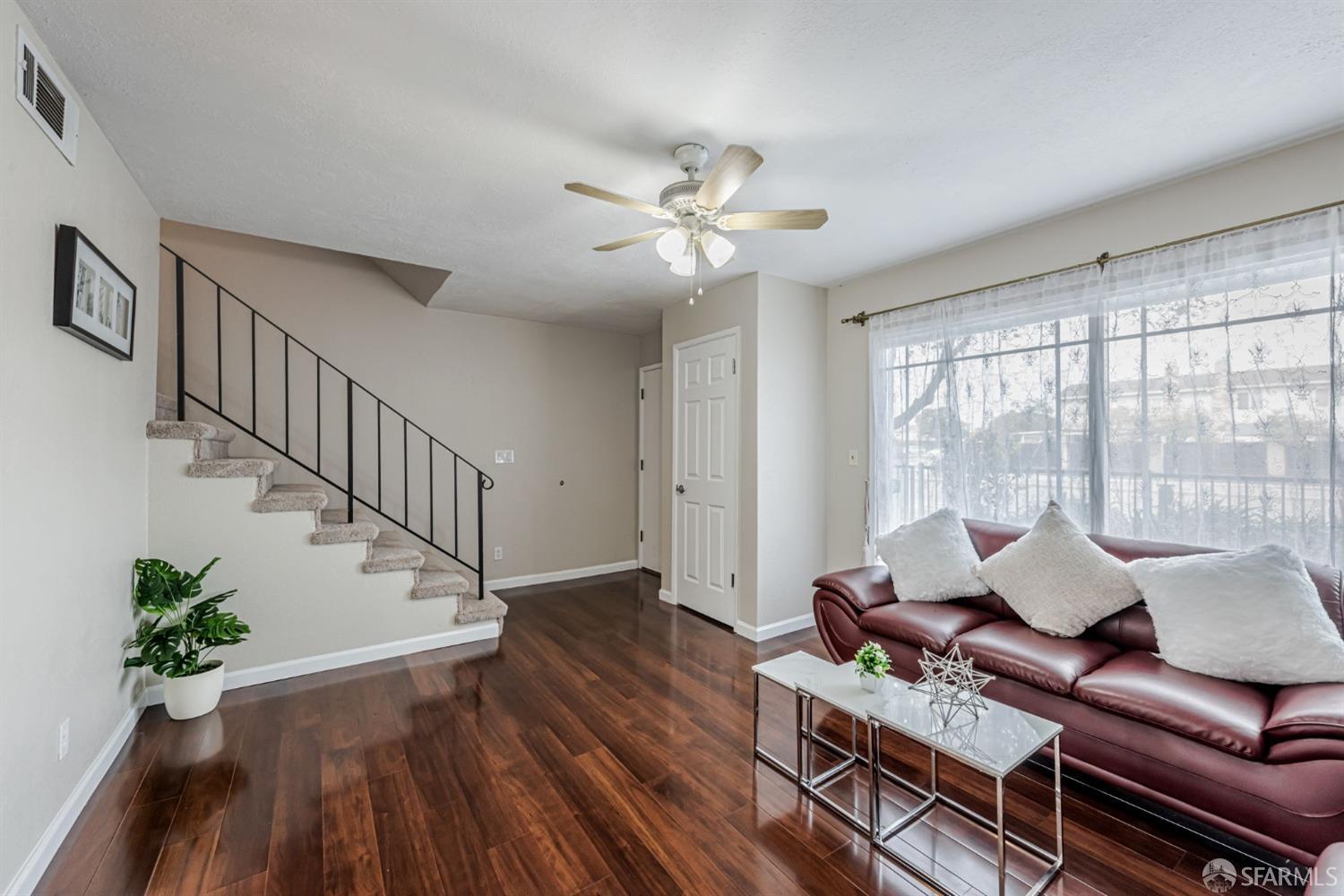 4346 Solano Way Union City, CA 94587 - Photo 4 of 40 a living room with furniture and wooden floor