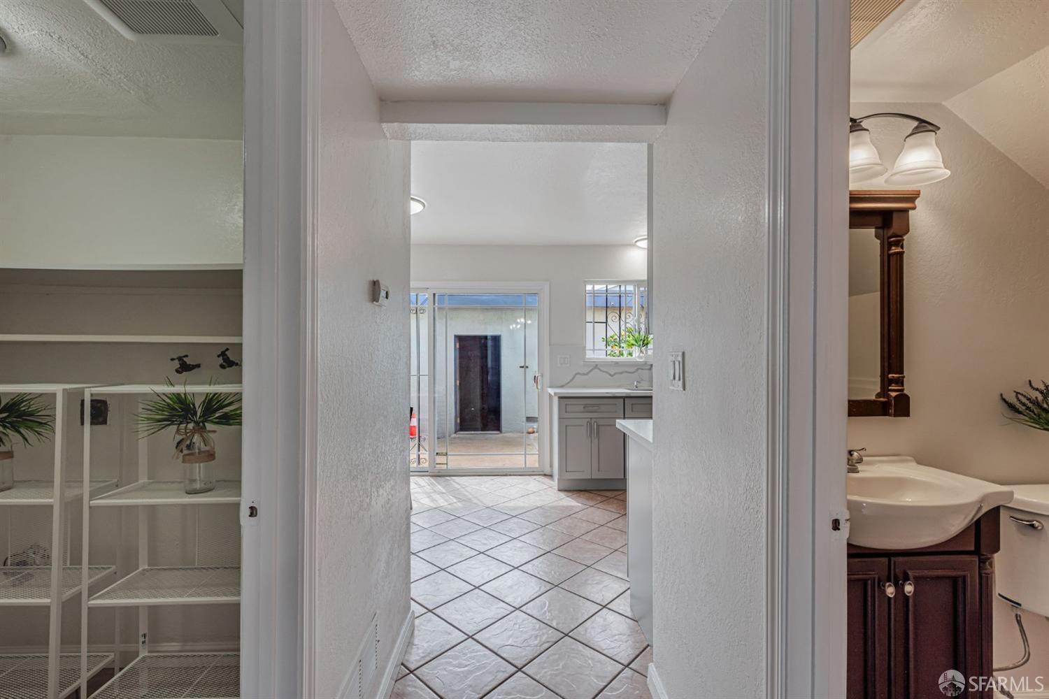 4346 Solano Way Union City, CA 94587 - Photo 6 of 40 a view of a hallway with bathroom and mirror