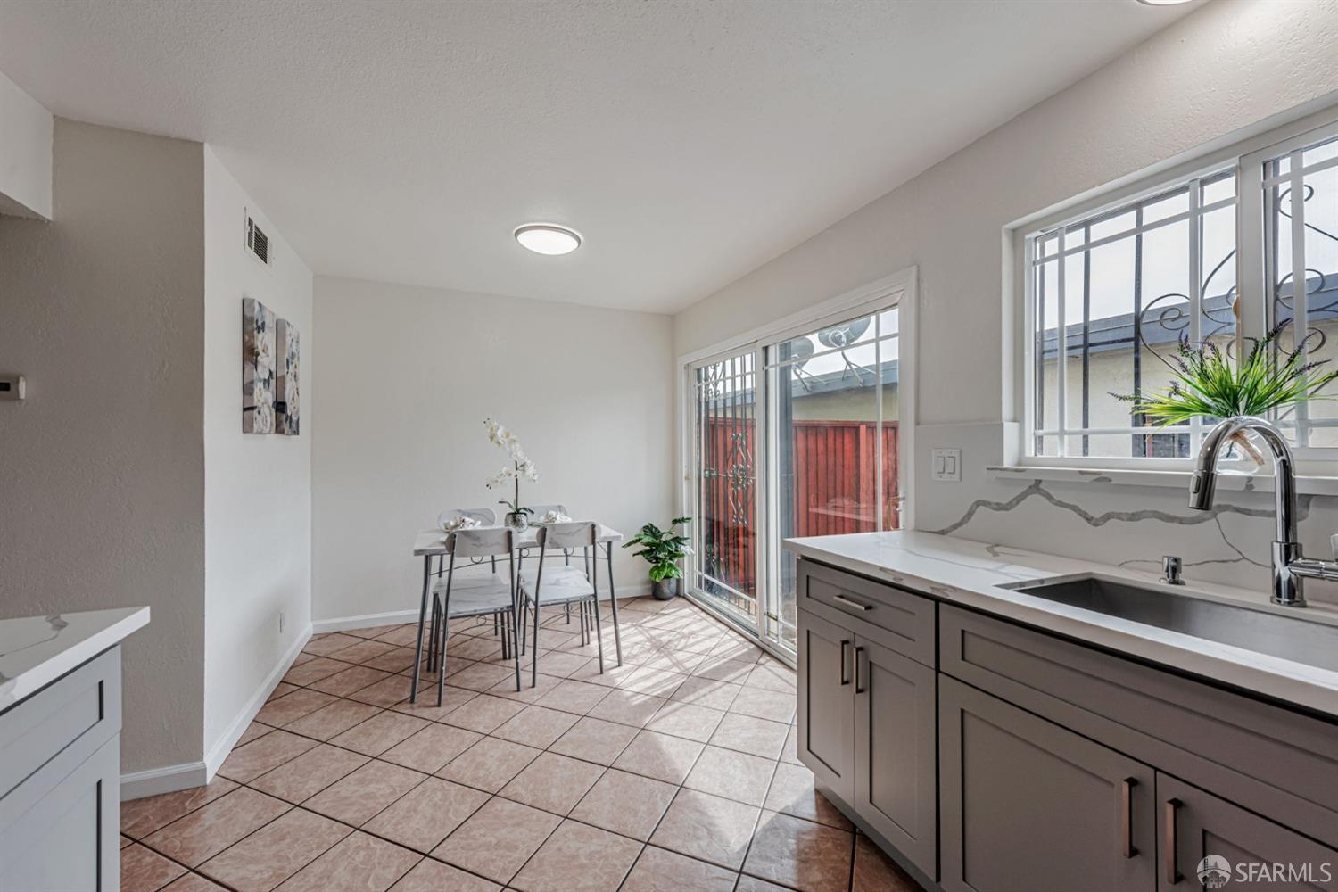 4346 Solano Way Union City, CA 94587 - Photo 9 of 40 a living room with furniture and a potted plant