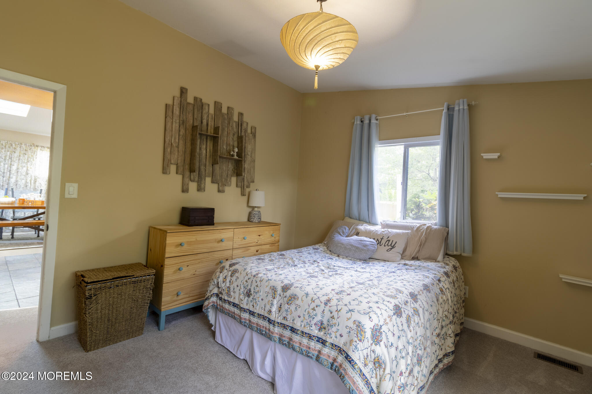 448 Cornell Drive Brick, NJ 08723 - Photo 11 of 28 a bedroom with a bed and a chandelier