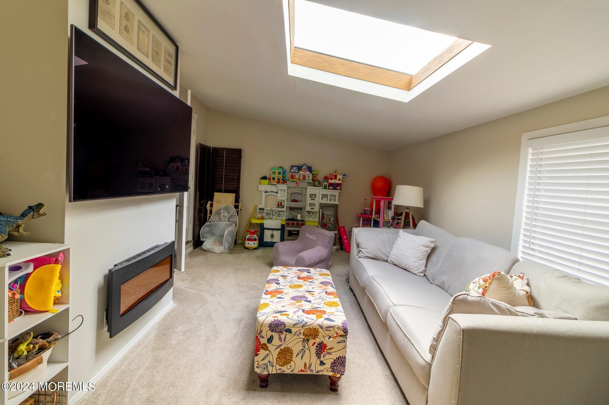 448 Cornell Drive Brick, NJ 08723 - Photo 9 of 28 a living room with furniture and a flat screen tv