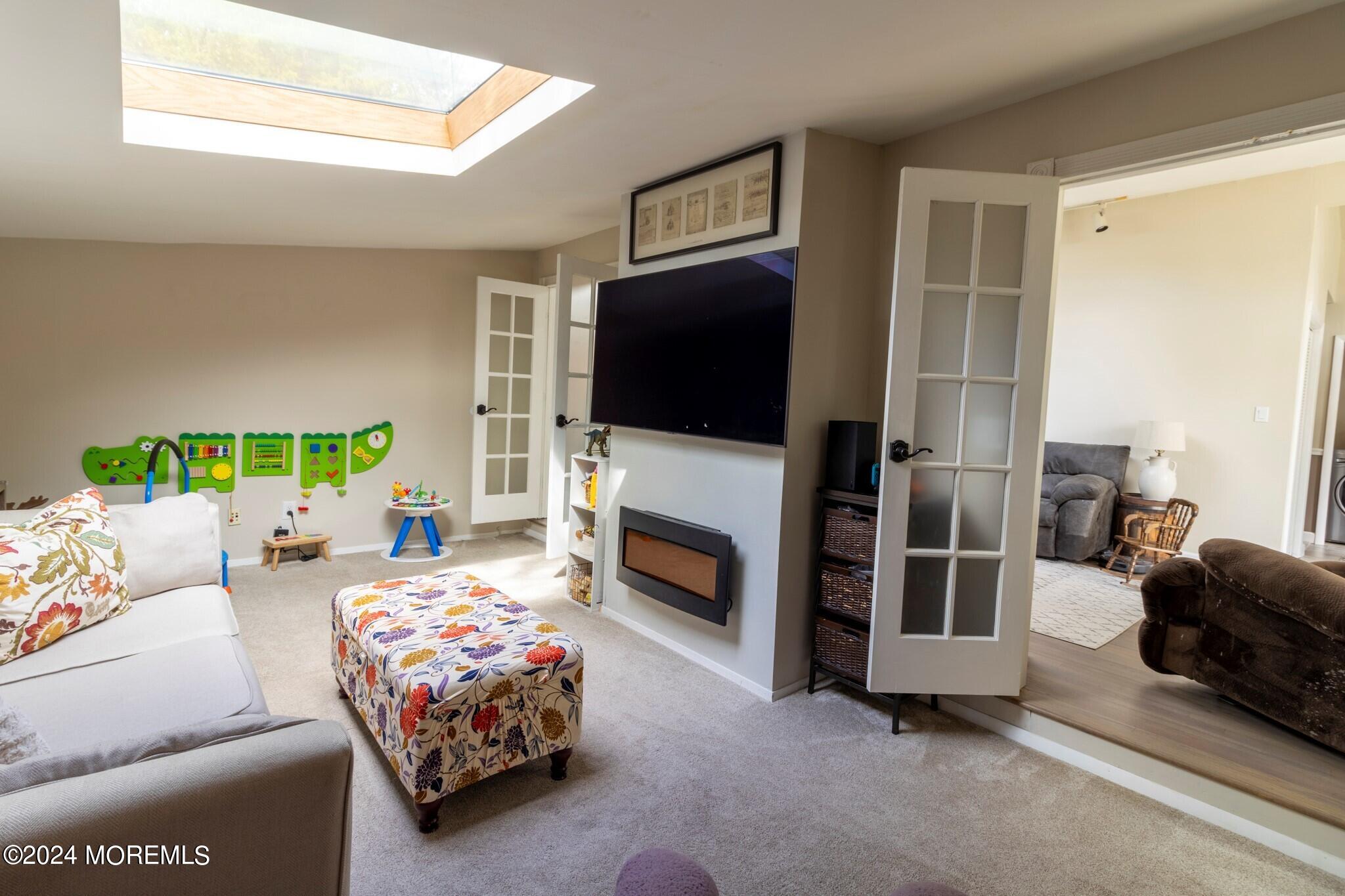 448 Cornell Drive Brick, NJ 08723 - Photo 10 of 28 a bedroom with a bed and a fireplace