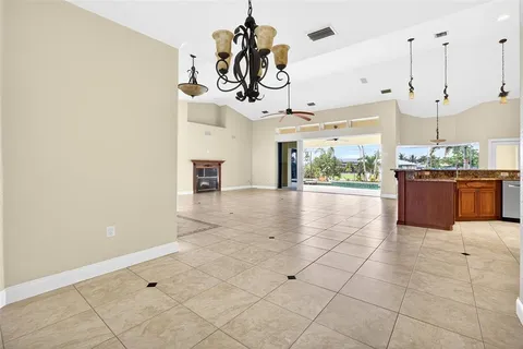 a kitchen with stainless steel appliances granite countertop a stove and a refrigerator