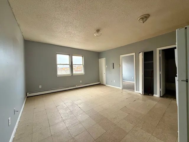 a view of empty room with windows