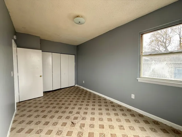 a view of a big room with a large window