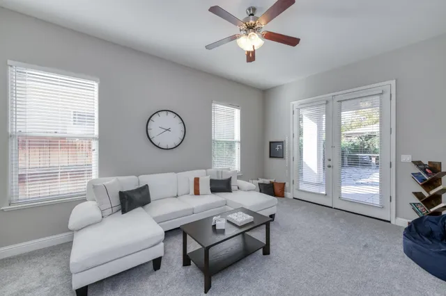 a living room with furniture and a window